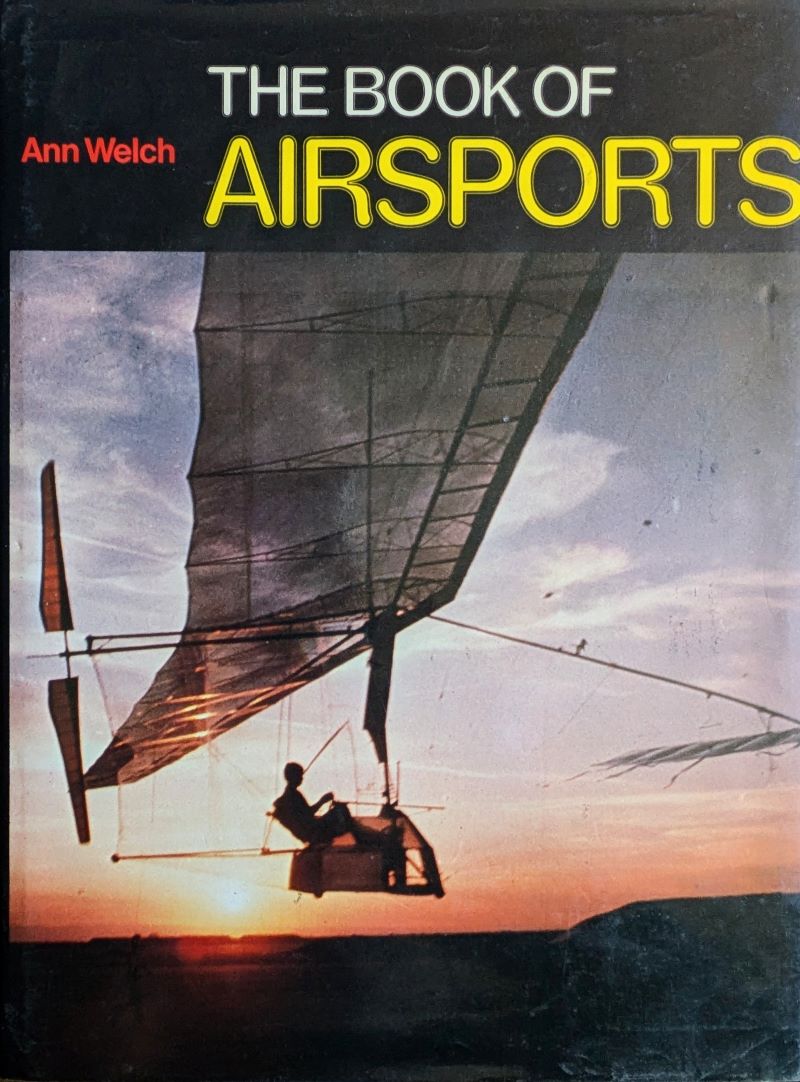 Picture of colour pictorial book cover showing a pilot sitting in a minimalist seat beneath an flimsy man-powered plane flying at sunset.
